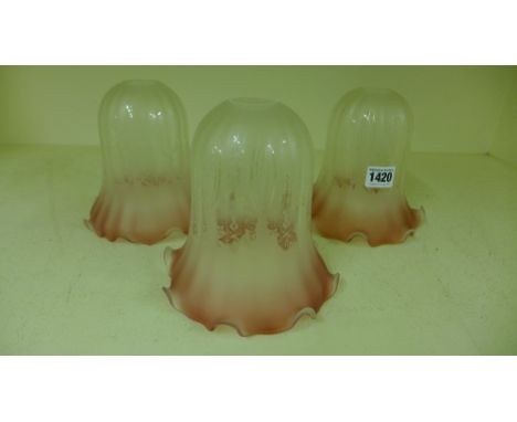A set of three Cranberry tinted frosted and etched glass lamp shades - Height 15 cm
Condition report: No faults