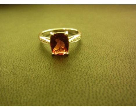 A 9ct gold andesine and diamond dress ring - Hallmarked Birmingham - Ring size N 1/2 - Weight approx 2.9gms
Condition Report: