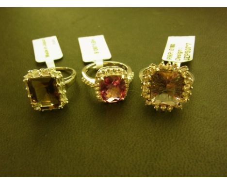 Three cluster rings - To include topaz and quartz - Stamped 925 - Ring sizes L, N, N 1/2 - Weight approx 12.9gms
Condition Re