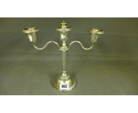 A silver three light candelabra - Birmingham 1957 - 58 - makers Adie Brothers - Height 21 cm - filled bases - Weight 18 troy 