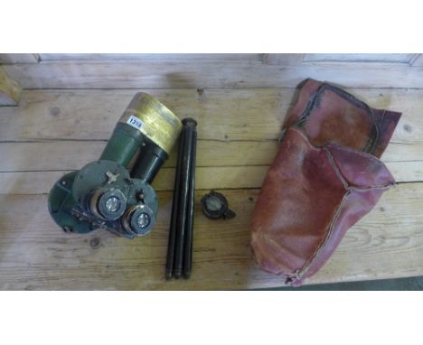 A pair of binoculars tripod and a 1940 compass