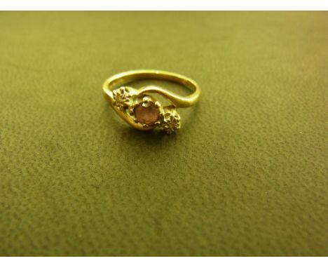 A 9ct gold amethyst and diamond three-stone crossover ring - Hallmarked Birmingham - Ring size K 1/2 - Weight approx 1.9gms
C