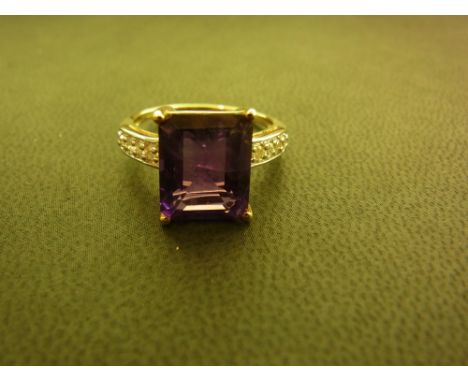 An amethyst and diamond dress ring - Hallmarked Birmingham - Ring size N 1/2 - Weight approx 3.1gms
Condition Report: Good