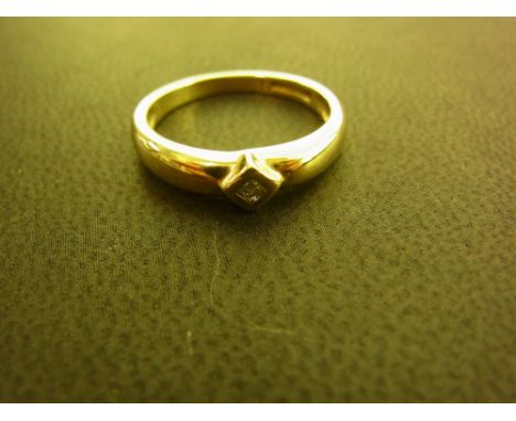 A 9ct gold diamond ring - The square-shape diamond to the plain band - Hallmarked Birmingham - Ring size K 1/2 - Weight appro