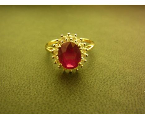 An 18ct gold ruby and diamond cluster ring - Hallmarked Birmingham - Ring size N 1/2 - Weight approx 2.9gms
Condition Report: