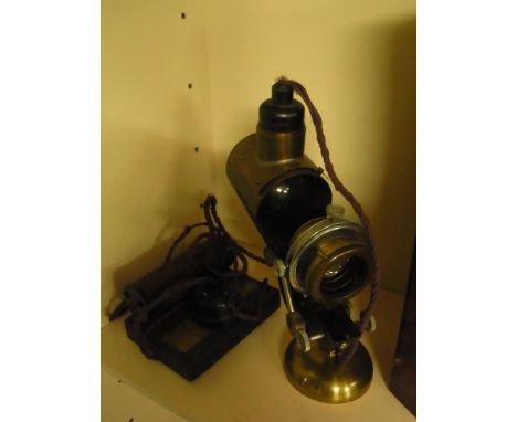 A brass projector on stand 