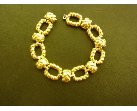 A fancy-link bracelet - Tests as 18ct gold - Length 20.5cms - Weight approx 57.5gms
Condition Report: Good - With light surfa