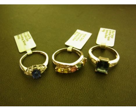 Three gem-set rings - To include tourmaline, topaz and kyanite - Stamped 925 - Ring sizes L, M 1/2 and N - Weight approx 8.8g