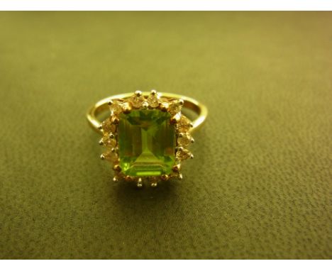 A 9ct gold peridot and diamond cluster ring - Hallmarked Birmingham - Ring size N 1/2 - Weight approx 3.0gms
Condition Report