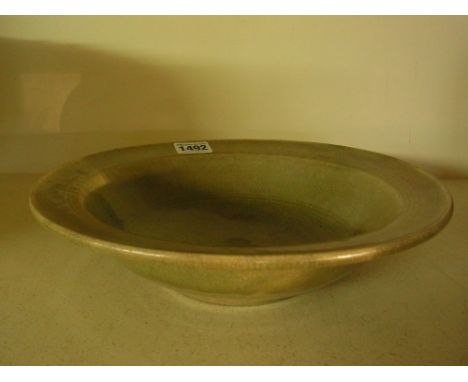 A South Asian Phan ware celadon dish with wide mouth incised with ring decoration, possibly 15th century  - Diameter 25 cm 
C