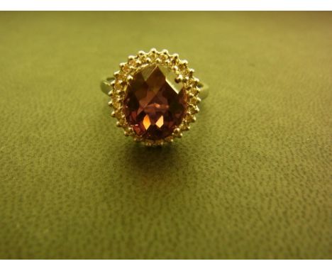 An 18ct gold rubellite and diamond cluster ring - Hallmarked Birmingham - Ring size N - Weight approx 4.6gms
Condition Report