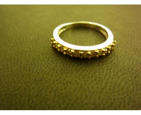 A 9ct gold yellow diamond eleven-stone band ring - Hallmarked Birmingham - Ring size L - Weight approx 2.5gms
Condition Repor