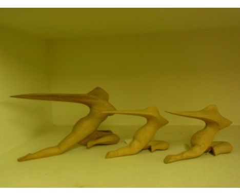 Three carved wooden figures of naked women from the Ubud region of Bali - Largest 33 cm long