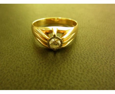 A 9ct gold diamond single-stone ring - The brilliant-cut diamond to the grooved shoulders and plain band - Estimated diamond 