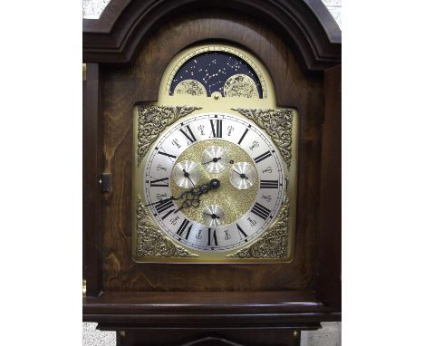 A modern mahogany-cased grandfather clock, having arched moon phase dial with day, month, date and seconds subsidiary and chi