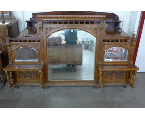 A large Victorian oak and pollard oak architectural framed mirror