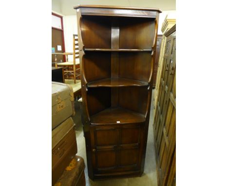 An Ercol freestanding corner cabinet