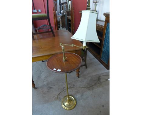 A mahogany and brass adjustable reading lamp