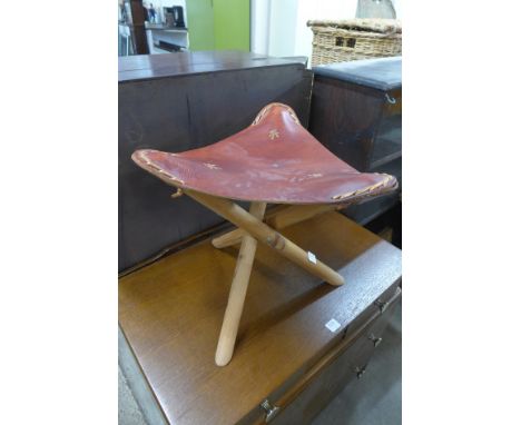 An Icelandic tripod leather seated stool