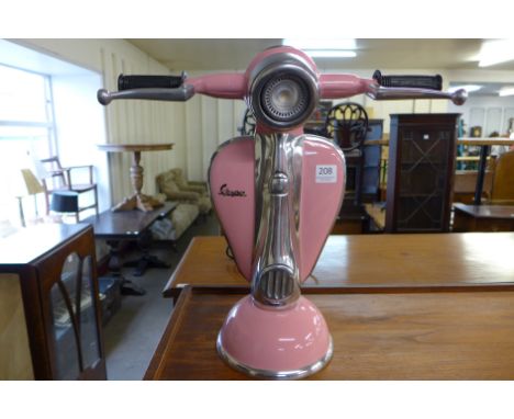 A pink Vespa table lamp