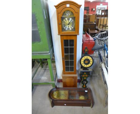 A dwarf longcase clock and two wall clocks