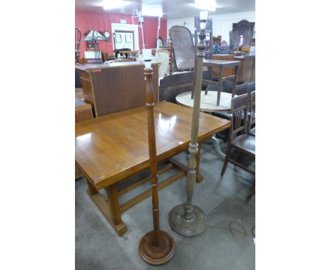 A beech standard lamp and a mahogany standard lamp