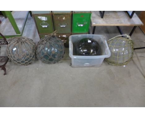 Four vintage glass fisherman's floats