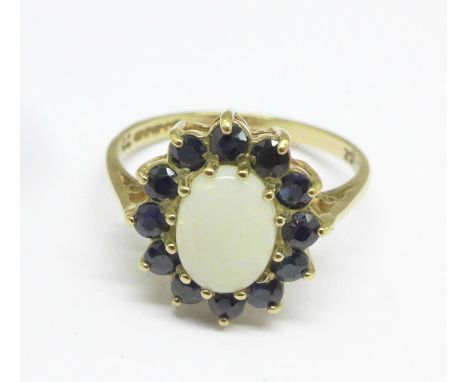 A 9ct gold, opal and blue cubic zirconium ring, 2g, M