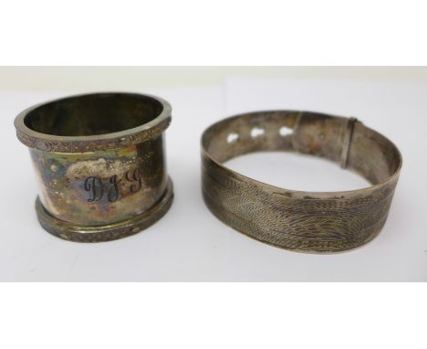 A silver napkin and a silver bangle, 76g