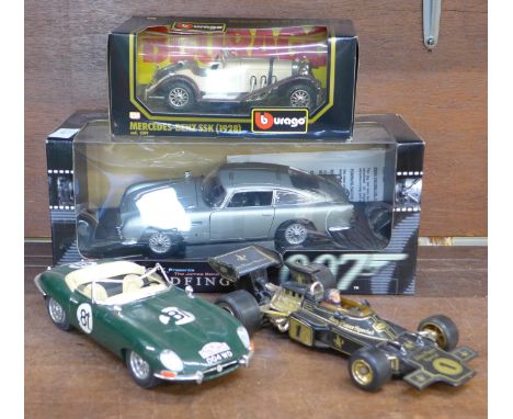 An Auto-Art Goldfinger Aston Martin DB5, boxed, a Burago Jaguar E-Type and a Burago Mercedes-Benz SSK 1928, boxed and a JPS C