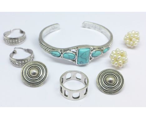 Two pairs of silver earrings, a silver ring, a pair of pearl earrings and a bangle