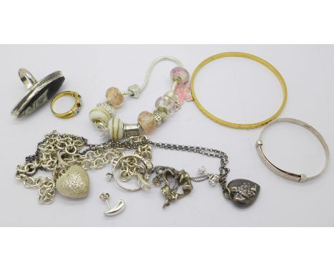 A silver necklace and heart shaped pendant, a silver christening bangle, charm bracelet, etc., 119g gross weight