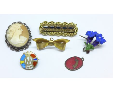 Five brooches, a 925 silver and enamel badge and a charm