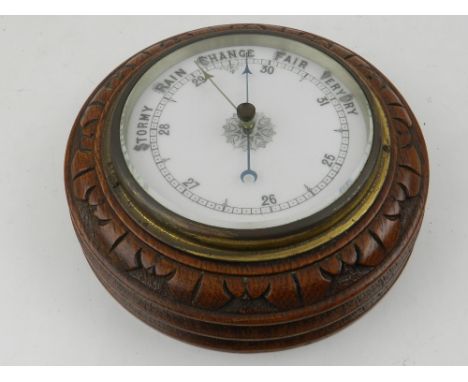 A 20th century circular oak barometer. 