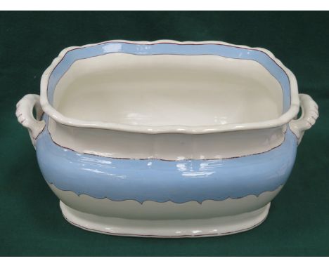 VICTORIAN TWO HANDLED CERAMIC FOOT BATH WITH BLUE, WHITE AND GILDED DECORATION
