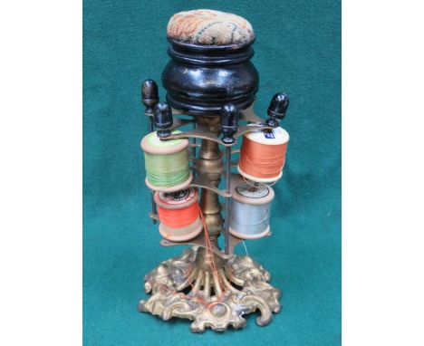 VICTORIAN STYLE EBONISED AND GILDED ROTATING BOBBIN STAND WITH PIN CUSHION TOP 