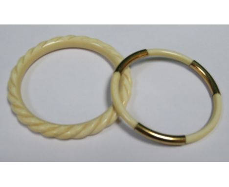 GOLD MOUNTED IVORY BANGLE AND ANTHER IVORY BANGLE *BUYERS NOTE- THIS LOT IS SUBJECT TO 20% VAT ON THE HAMMER PRICE 