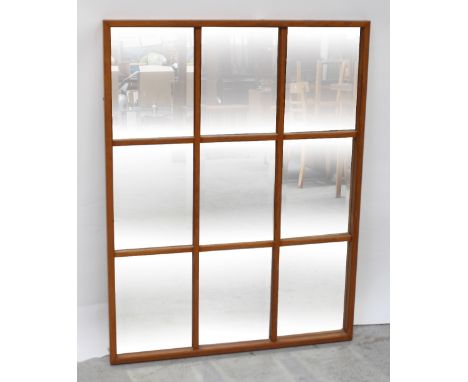 A mahogany-framed sectional wall mirror with nine sections, length 109cm. CONDITION REPORT The central glass panel is loose.