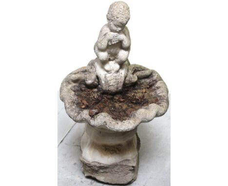 Garden statuary to include a cherub on shell birdbath.