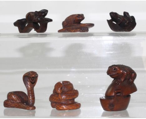Six boxwood netsuke to include a rat on a ryu sceptre, two snakes and three money toads, one perched on a cooking pan, height