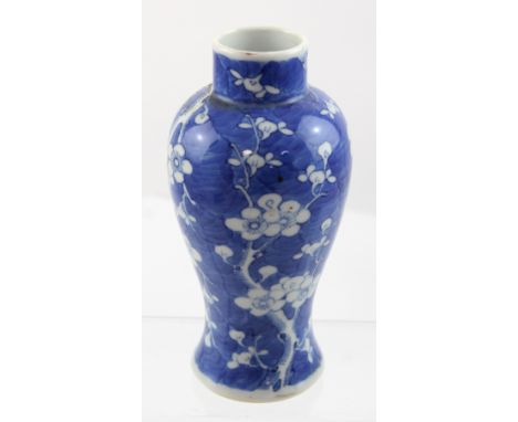 A 19th century Chinese porcelain baluster vase with four character Kangxi mark to base, decorated in the cracked ice and prun