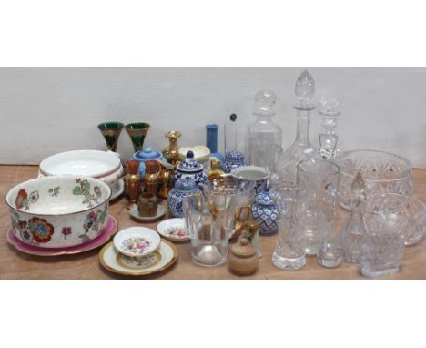 A collection of lead crystal to include three assorted decanters, one with enamelled brandy label, a selection of bowls and v