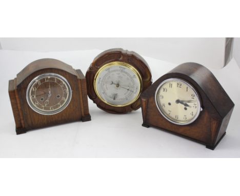 Two c1950s oak cased mantel clocks, both dials set with Arabic numerals and a barometer in a wooden mount in the form of the 