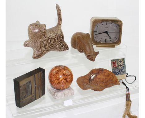 A small group of collectibles to include a cast brass paperweight, two carved zebra wood animals by John Fox, one marked 'Pee