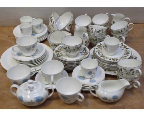 A quantity of Wedgwood tea and dinner ware, white ground with blue roses, to include plates, cups, saucers, coffee cups, sucr