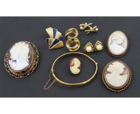 A cameo brooch in a 9ct gold frame, two cameo brooches in yellow metal frames, a yellow metal bangle and five pairs of yellow