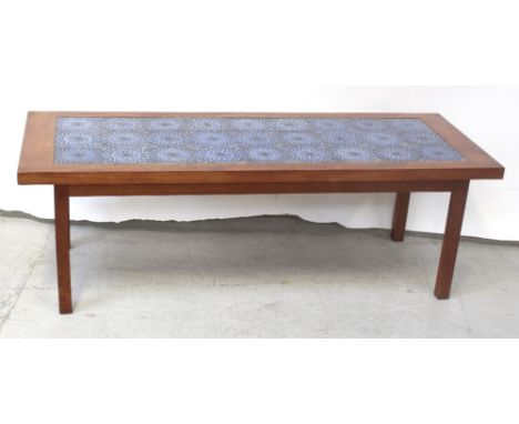 A vintage mahogany tile-top table on block supports, length 157cm.