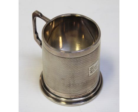 A George VI hallmarked silver engine-turned Christening mug, Birmingham 1938, approx 5.5ozt.