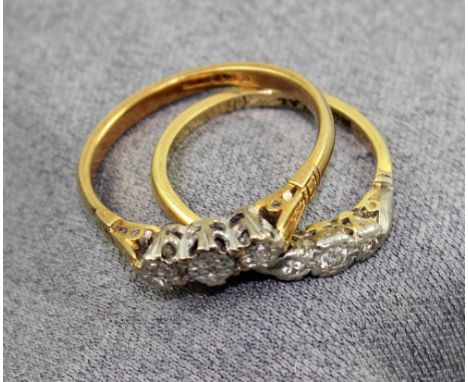Two 18ct gold and platinum rings, each illusion-set with three small graduating diamonds, sized P and K, approx combined 4.9g