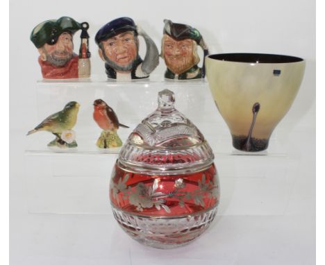 Royal Doulton; three character jugs, D6619 'Smuggler', D6506 'Captain Ahab' and D6534 'Robin Hood', two Beswick figures of bi